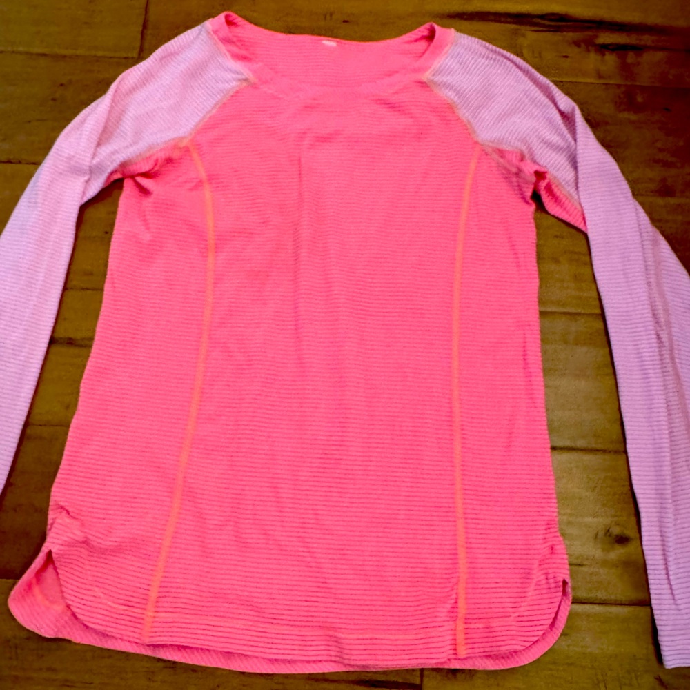 Lululemon pink top with stylish accents. Size 8